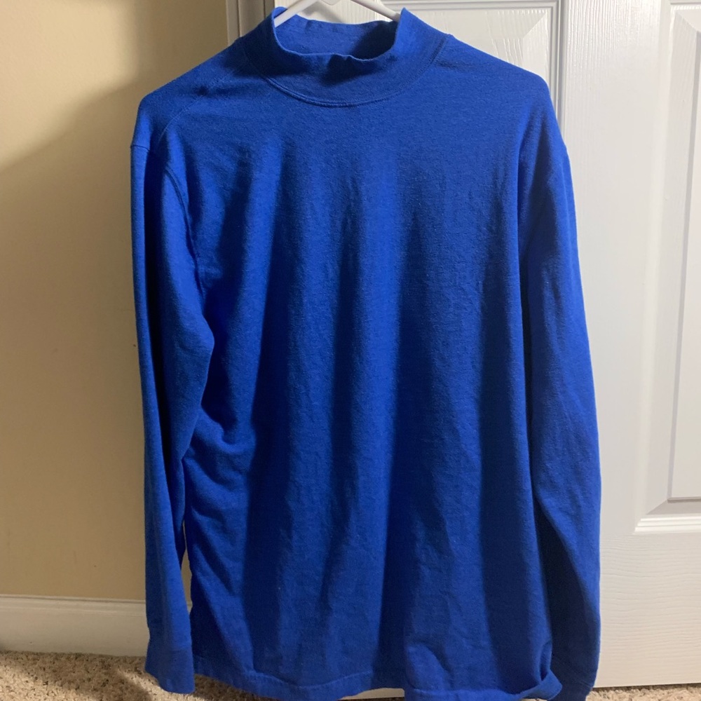 Blue mock turtleneck long sleeve shirt.